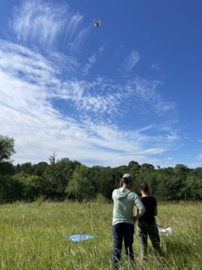 Drone Over Two Field Researchers